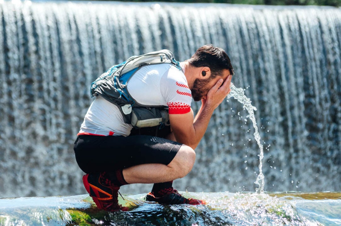 Caucasian male runner having break from activity